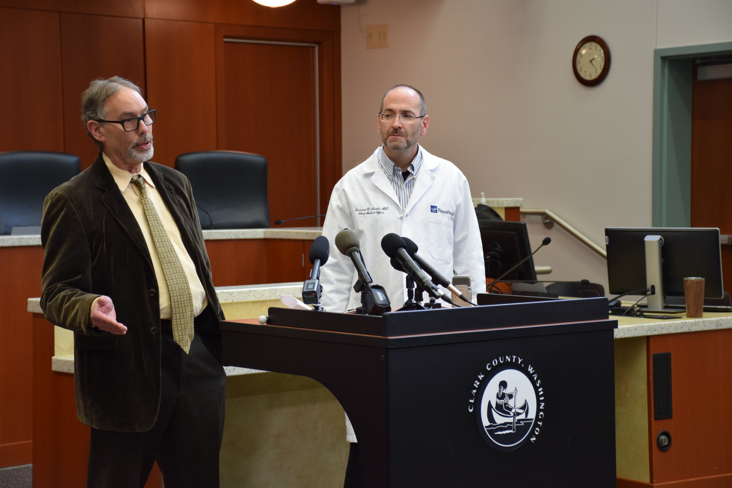 FILE PHOTO: Clark County Public Health Director Alan Melnick, left, and PeaceHealth Southwest Medical Center Chief Medical Officer Lawrence Neville, address media during a press conference March 13 on two new cases of COVID-19 confirmed in Clark County.