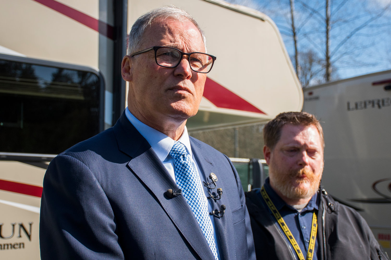 Gov. Jay Inslee, left, takes a tour with Incident Commander for the Washington State Department of Health, Nathan Weed, right, of a potential COVID-19 quarantine and isolation site at Maple Lane in March 2020.
