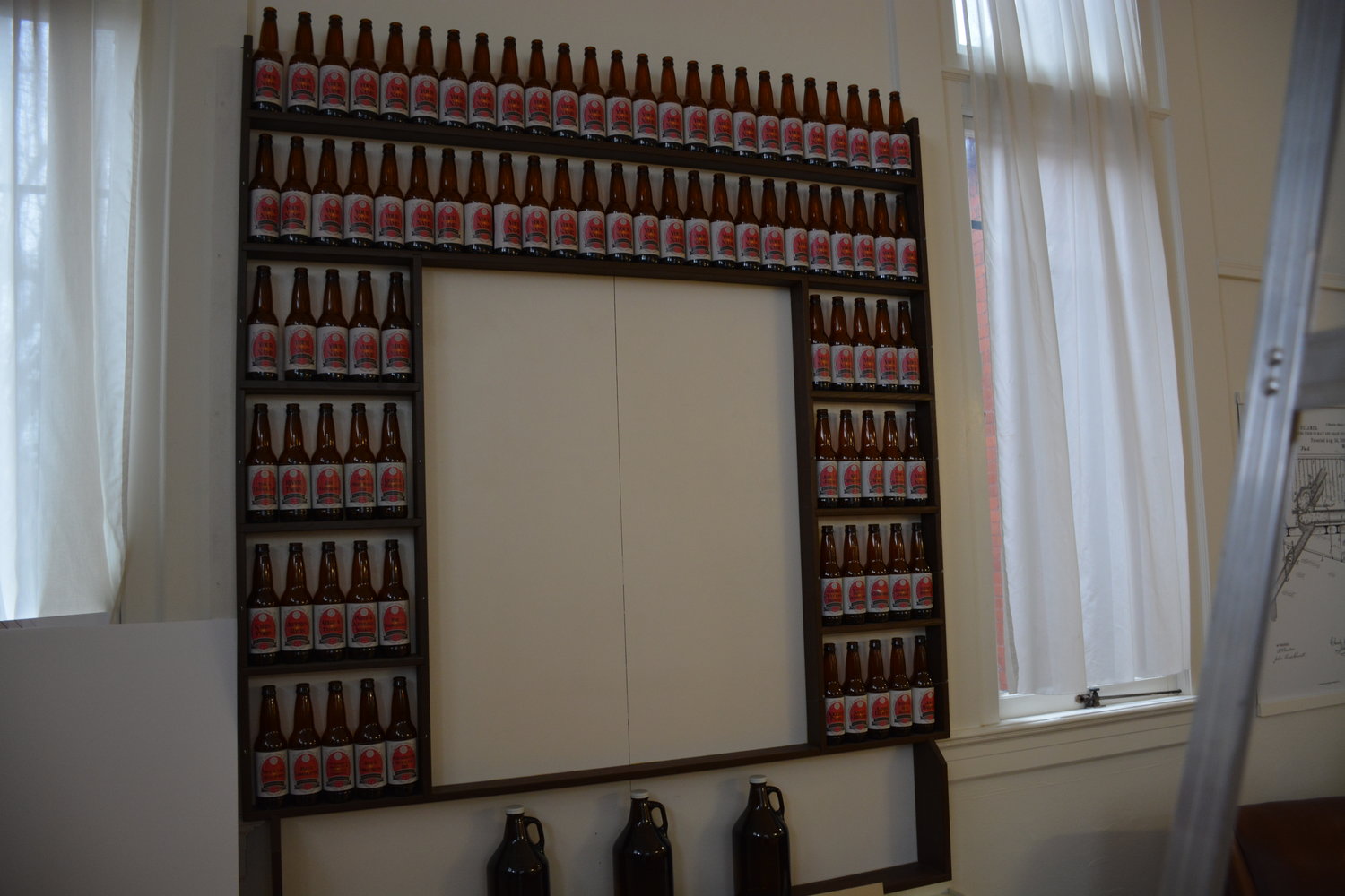 Supporters of the museum “purchase” beer bottles to line a wall in the exhibit. The bottles are available until there’s “99 Bottles of Beer on the Wall.”