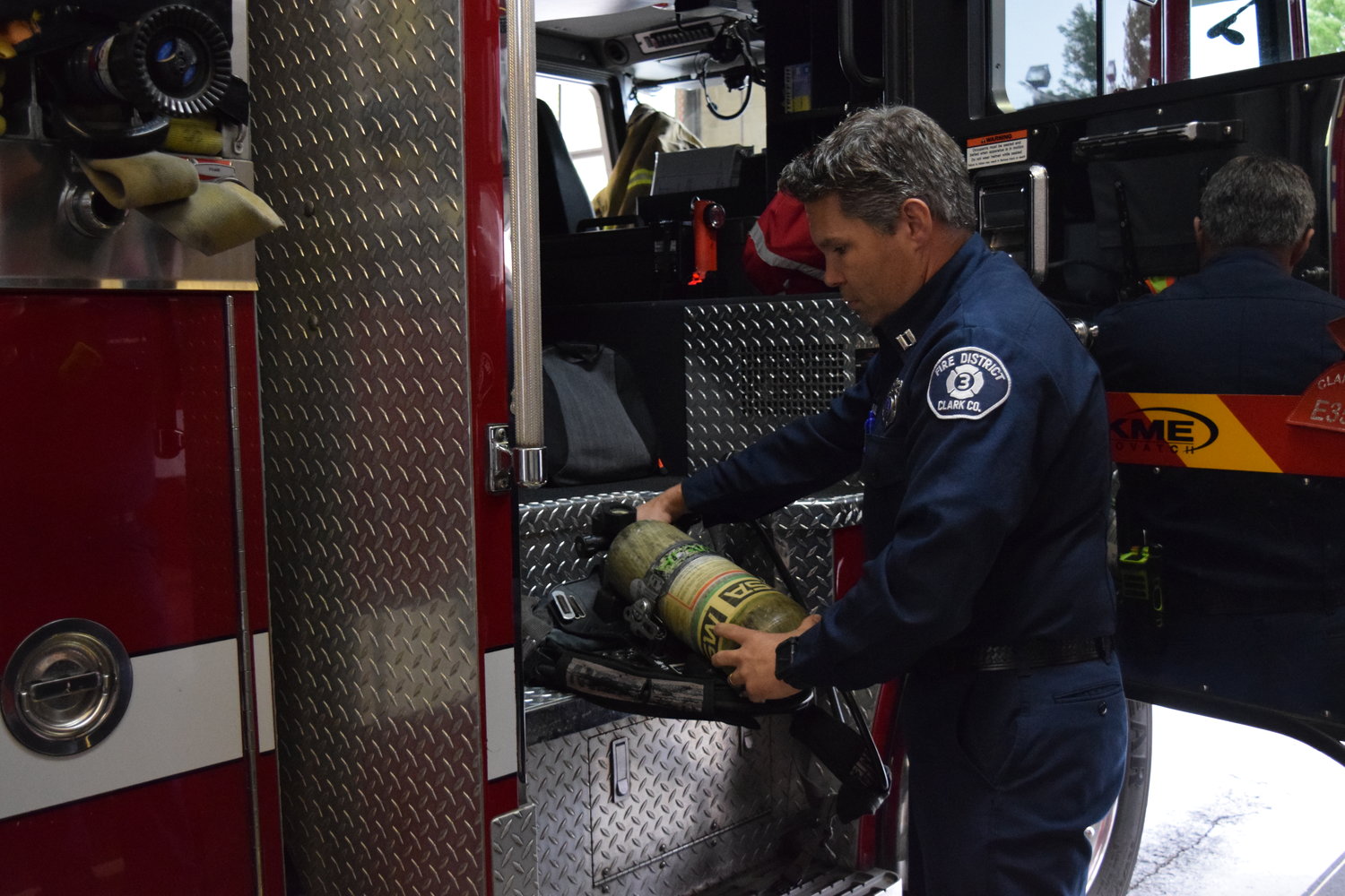 Fire District 3 Captain Brian Brault checks an oxygen tank at the Battle Ground fire station Sept. 26.