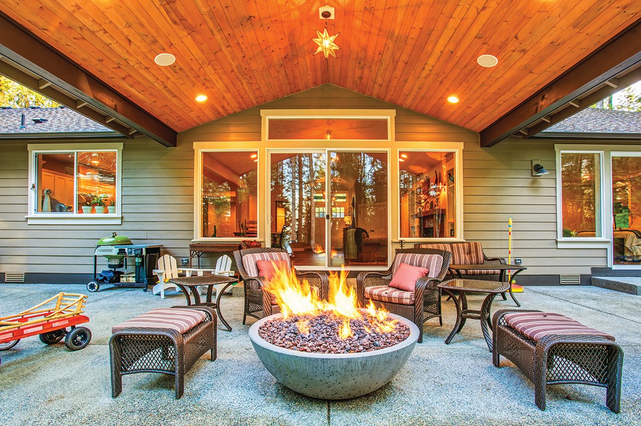 Covering a deck or patio and/or adding a fire feature are two ways to make outdoor living spaces more winter-friendly