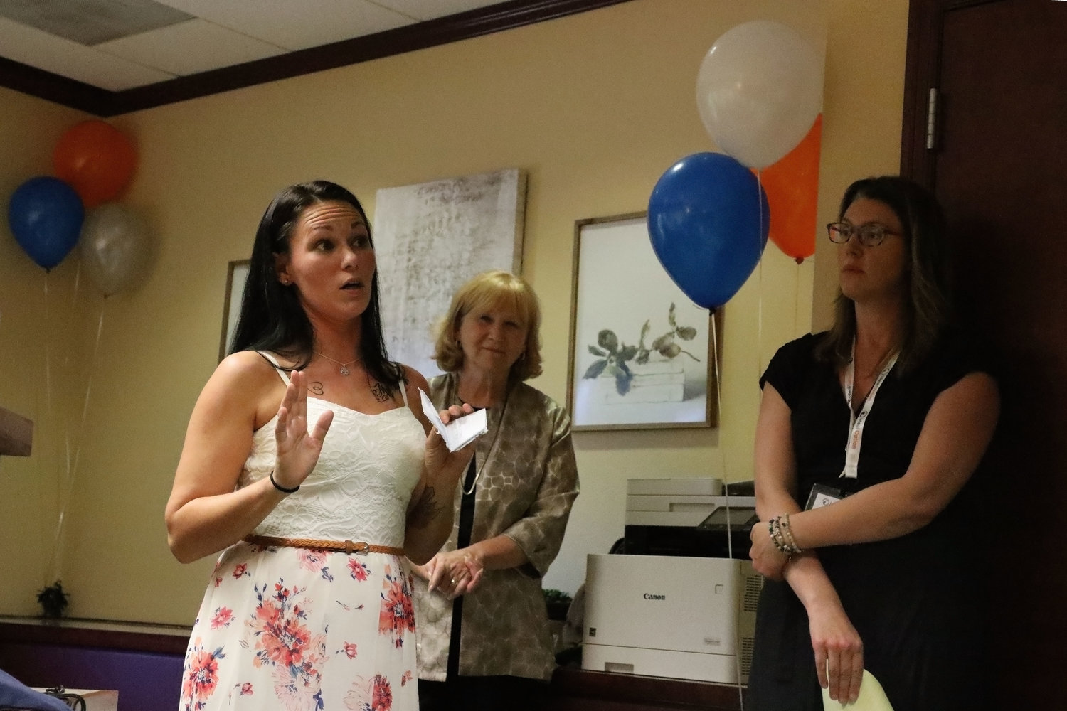 Vancouver resident Jenna Tuttle (left) shares her story with Anne McEnerny-Ogle, the Mayor of Vancouver (center), and advanced registered nurse practitioner Lindsey Huckett at the grand opening of Ideal Option in Vancouver Aug. 1. Tuttle has been now sober for three years, thanks to the help of Ideal Option.