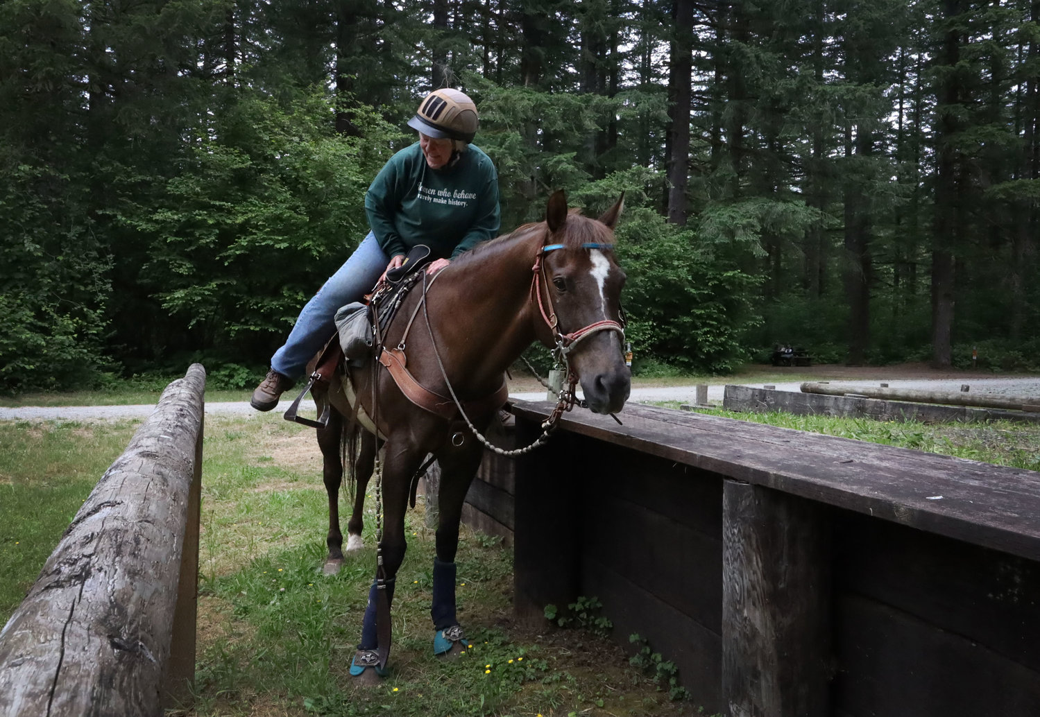Barbara Thomas from Hockinson gets on her horse, Anthony, using the mount assistance area at Rock Creek Horse Camp in Yacolt June 25. The camp also includes ADA accessible camping spots.