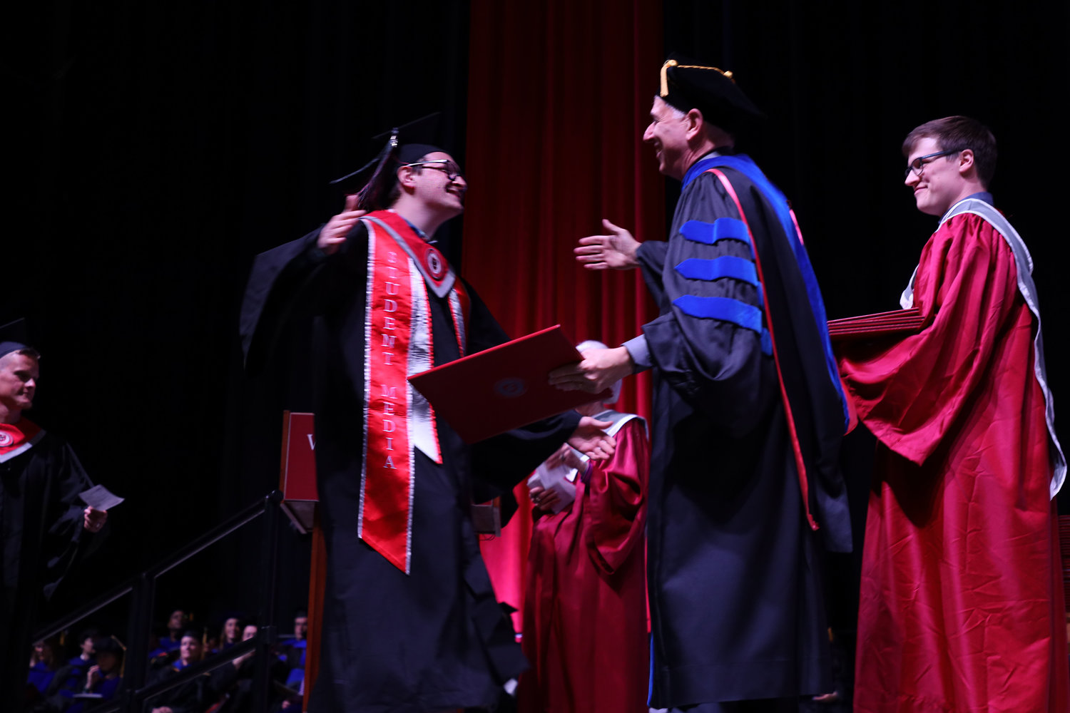 (Left) Zeke Estes from Woodland before embracing chancellor Mel Netzhammer during the Washington State University Vancouver graduation, at the Clark County Fairgrounds, May 4. Estes graduated with his Bachelors in science and electrical engineering.