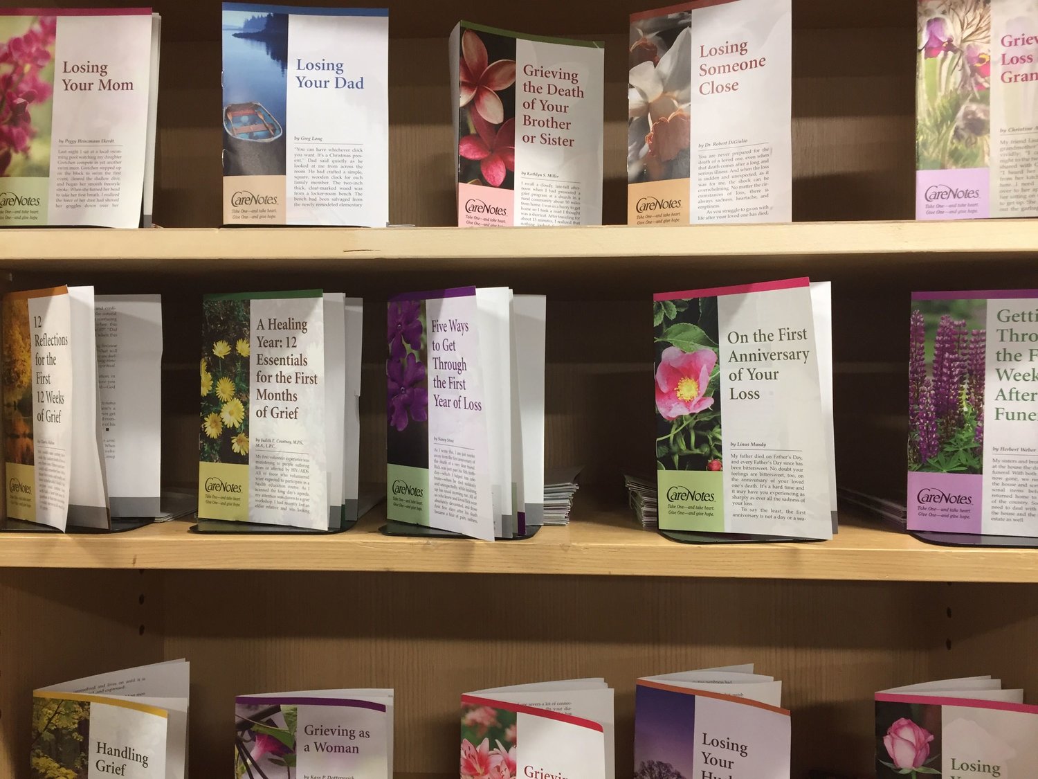 Booklets addressing different forms of grief line a set of shelves at Seasons of Hope in Salmon Creek. 