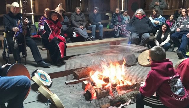 Members of the Cowlitz Tribe tell stories around the fire at the Cathlapotle Plankhouse in the Ridgefield National Wildlife Refuge Dec. 21 to welcome the first day of winter.