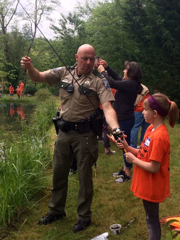 Fish and Wildlife officers were on hand to teach campers how to properly catch a trout. 