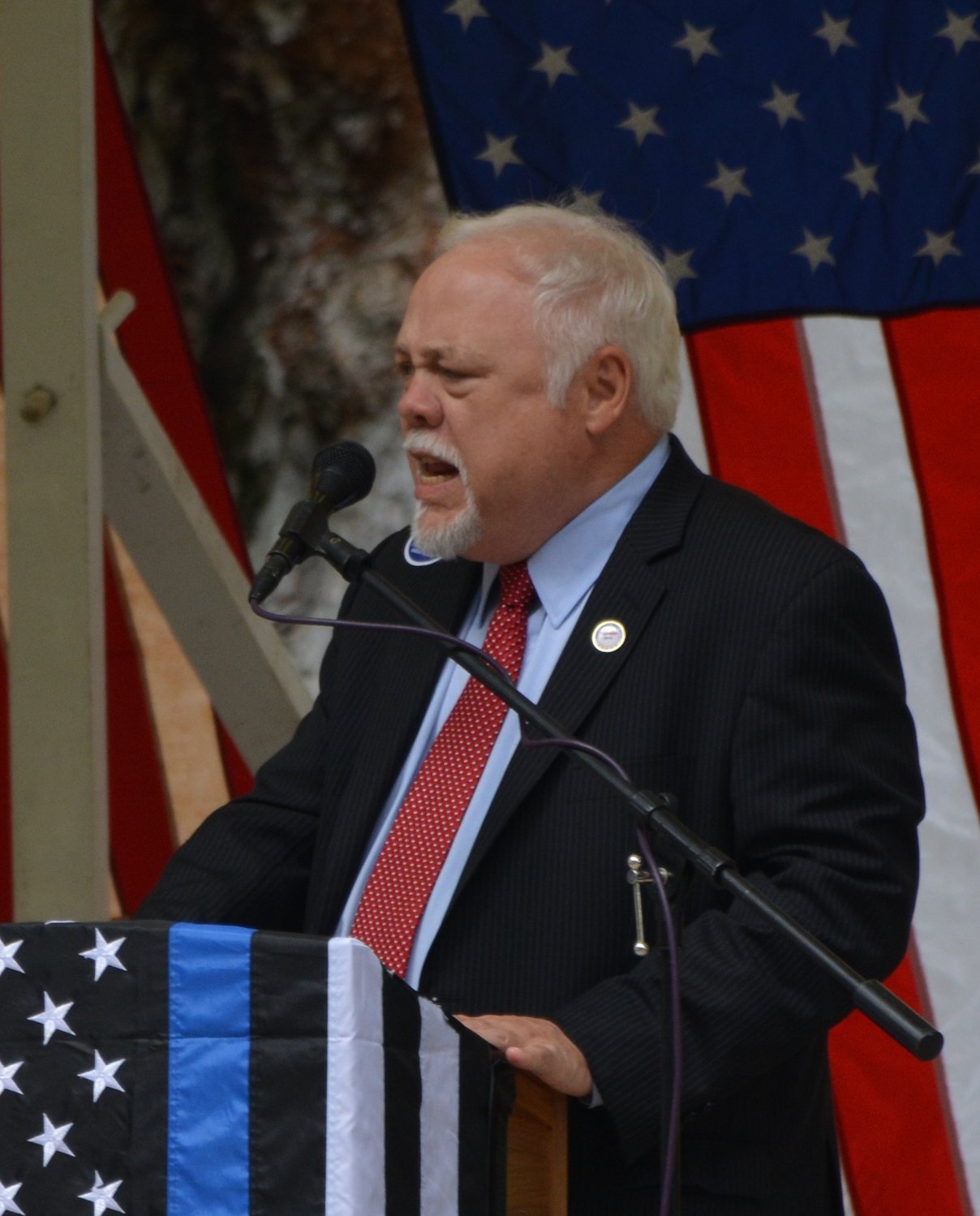 Former Washington State Senator Don Benton addresses a crowd gathered in support of then presidential candidate Donald Trump during a rally last year. Benton was recently appointed to the U.S. Selective Service Systems as its director.