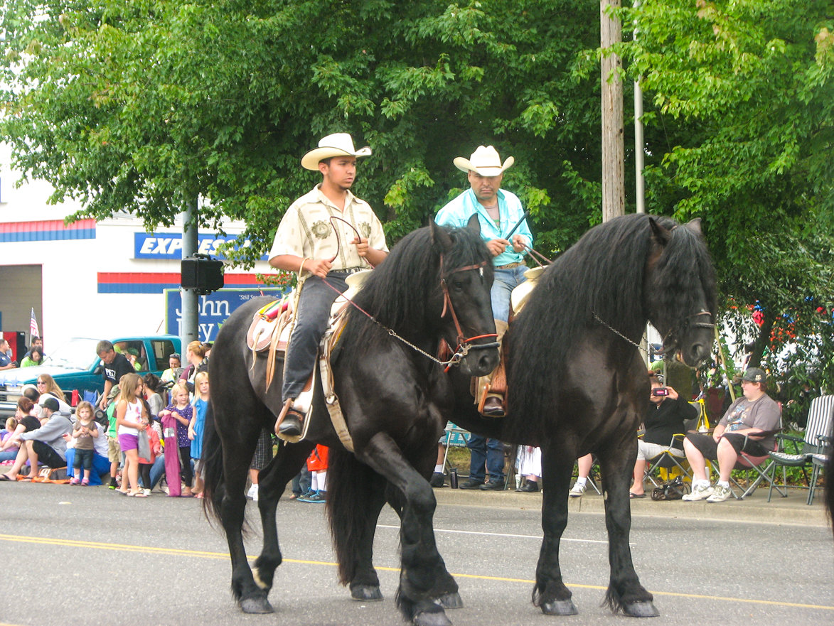 HORSES AND THEIR RIDERS are a common sight in the annual Battle Ground Harvest Days Parade.