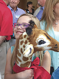 BREANNA BULLION, OF La Center, celebrates her 10th birthday at another 10-year-birthday bash for the Legacy Salmon Creek Medical Center in Vancouver. Bullion was the medical center’s first patient when it opened in 2005. Since the hospital’s anniversary celebration fell on Breanna’s actual 10th birthday, Legacy administrators gifted her with this stuffed giraffe and sang ‘Happy Birthday’ to the beaming La Center girl. 
