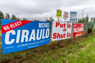 BATTLE GROUND CITY COUNCIL Member Philip Johnson put up a sign of his own among several campaign signs in the Battle Ground area. The sign simply reads: “Put Up or Shut Up” and is directed at fellow council members Mike Ciraulo and Adrian Cortes. Cortes and Ciraulo recently wrote an op-ed piece that appeared in two area newspapers that suggested that some council members may have violated the Washington State Open Meetings Act by getting together and discussing potential changes to the council’s Governance Coordination Manual. Johnson’s sign, a photo of which was posted on the “Battle Ground, WA” Facebook page, has caused a small stir among some Battle Ground residents who have left comments on the Facebook post. Some have suggested that the sign be removed, including Battle Ground City Council candidate Mike Dalesandro.Photo by Mike Schultz.