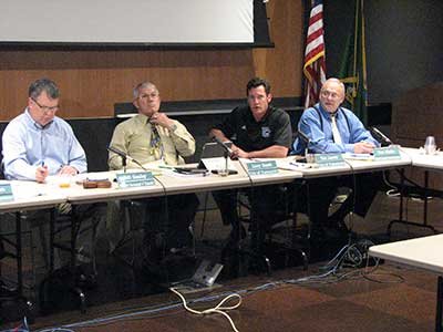 VANCOUVER MAYOR Tim Leavitt, shown here second from right, has been accused of having a conflict of interest by fellow C-TRAN board member David Madore, who filed a protest that alleges Leavitt failed to disclose that his company has a contract with TriMet. The C-TRAN board is considering the terms of an agreement with TriMet for the operation of light rail in Clark County.