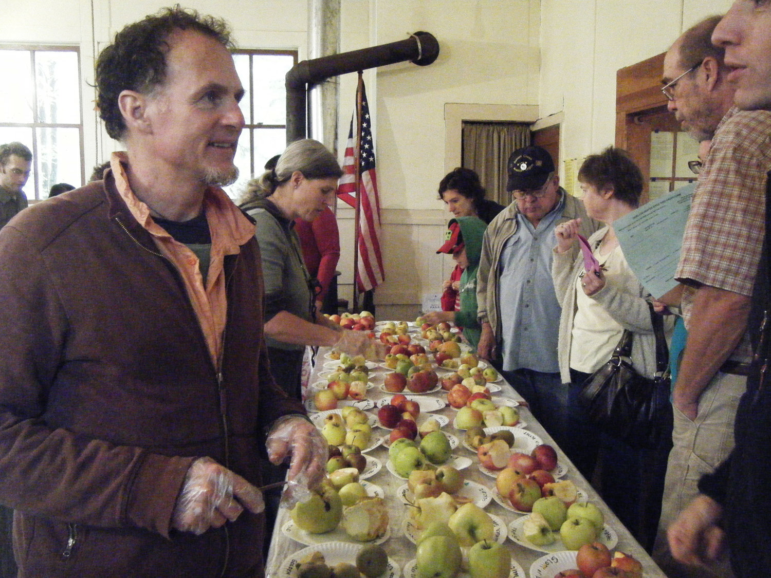 TAGGART SIEGEL and Leah Hansen slice up apples for folks at the Heirloom Apple Festival for tastings. The Heirloom Apple Festival features more than 200 different kinds of apples that attendees can taste. All of the apples taste different – some sweet, tart or juicy.