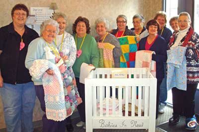 MEMBERS OF THE Patchwork Pals, who are from the La Center Free Evangelical Church, help by making quilts and other items for the Babies In Need organization.