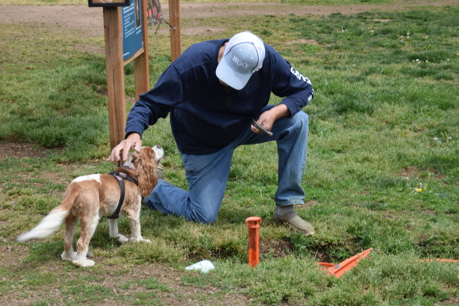 DOGPAW Park Operations Director Marty Rutkovitz greets Chauncey during a cleanup event at Lucky Dog Park in Brush Prairie May 8.