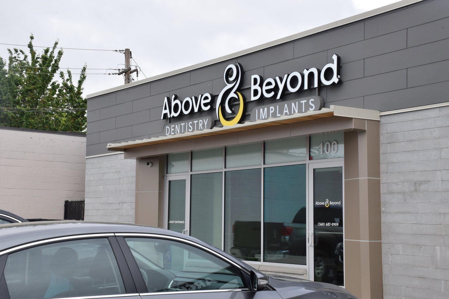 Above and Beyond Dentistry & Implants’ back entrance sits off of W. 1st St. in Battle Ground May 20.