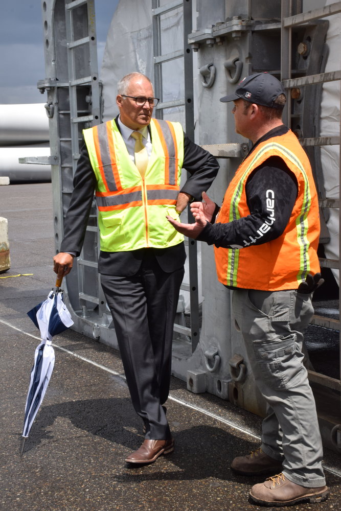 From left, Gov. Jay Inslee talks with ILWU Local 4 President Cager Clabaugh while touring the Port of Vancouver on June 15.