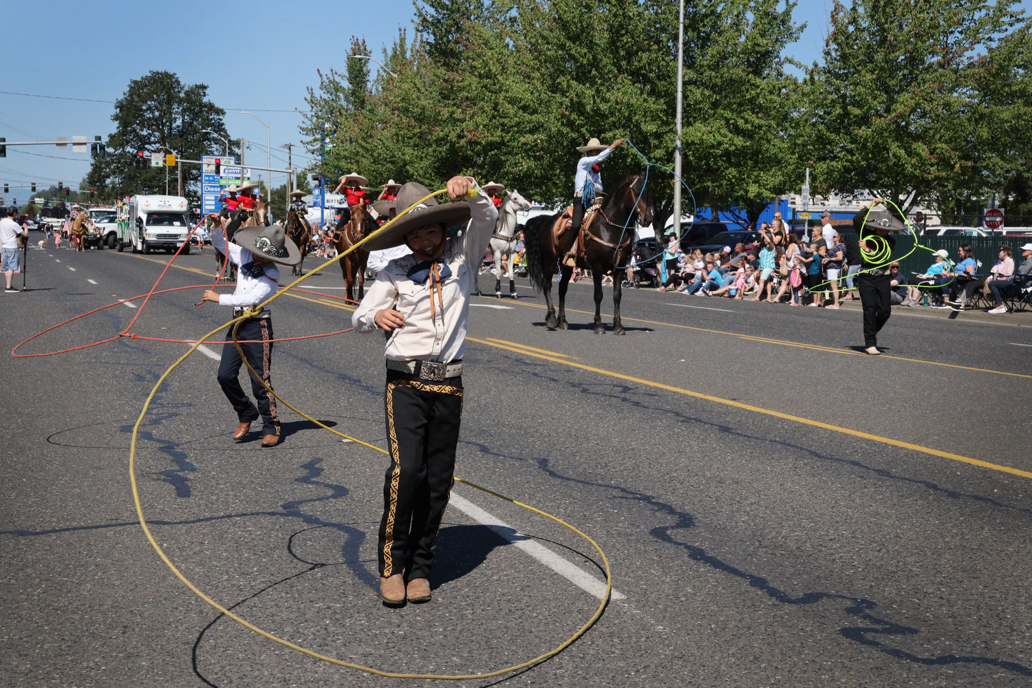 Performers spin lassos during the Battle Ground Harvest Days parade in 2019. The parade and a number of other events are making a return this year following a hiatus in 2020 due to the COVID-19 pandemic.