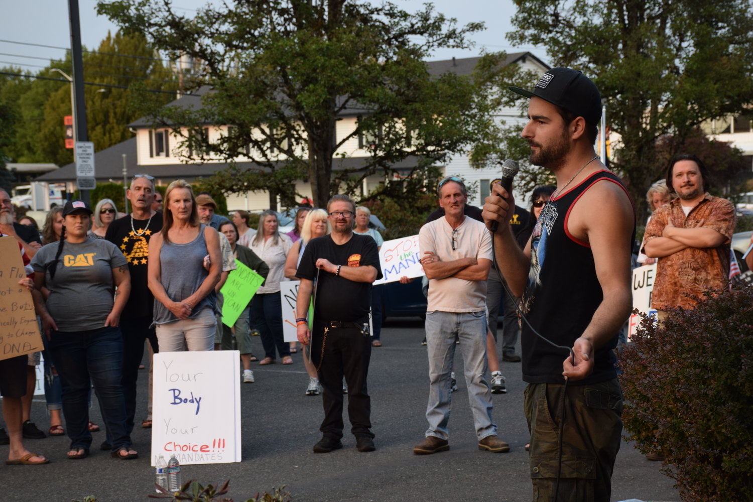 Battle Ground City Council candidate Josh VanGelder speaks to a crowd gathered in front of city hall on Sept. 7 to support a “medical freedom” ordinance under consideration by the council.