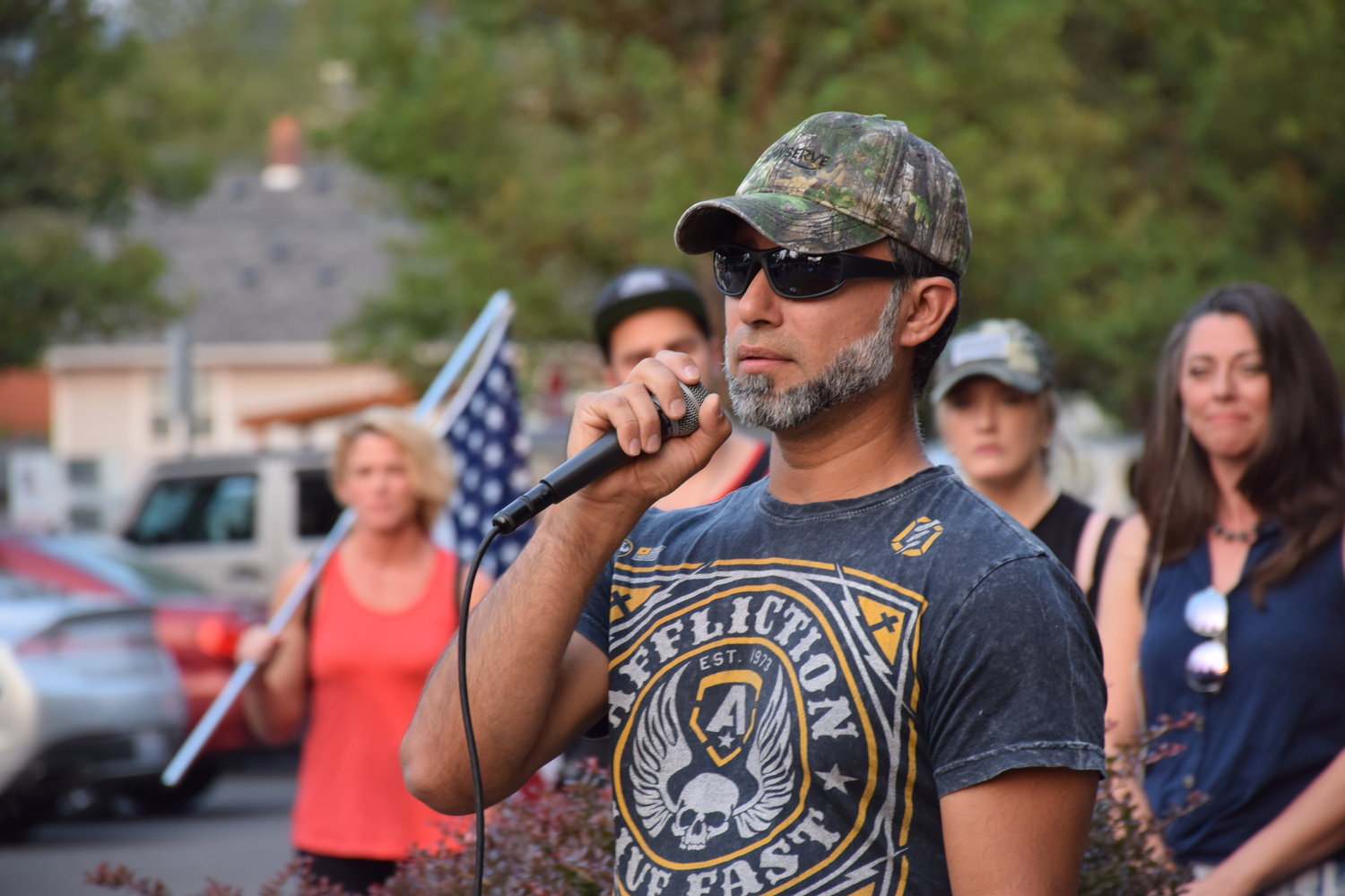 Manny Cortes, brother of Battle Ground Mayor Adrian Cortes, speaks to a crowd gathered in front of city hall on Sept. 7 to support a “medical freedom” ordinance city council is considering.