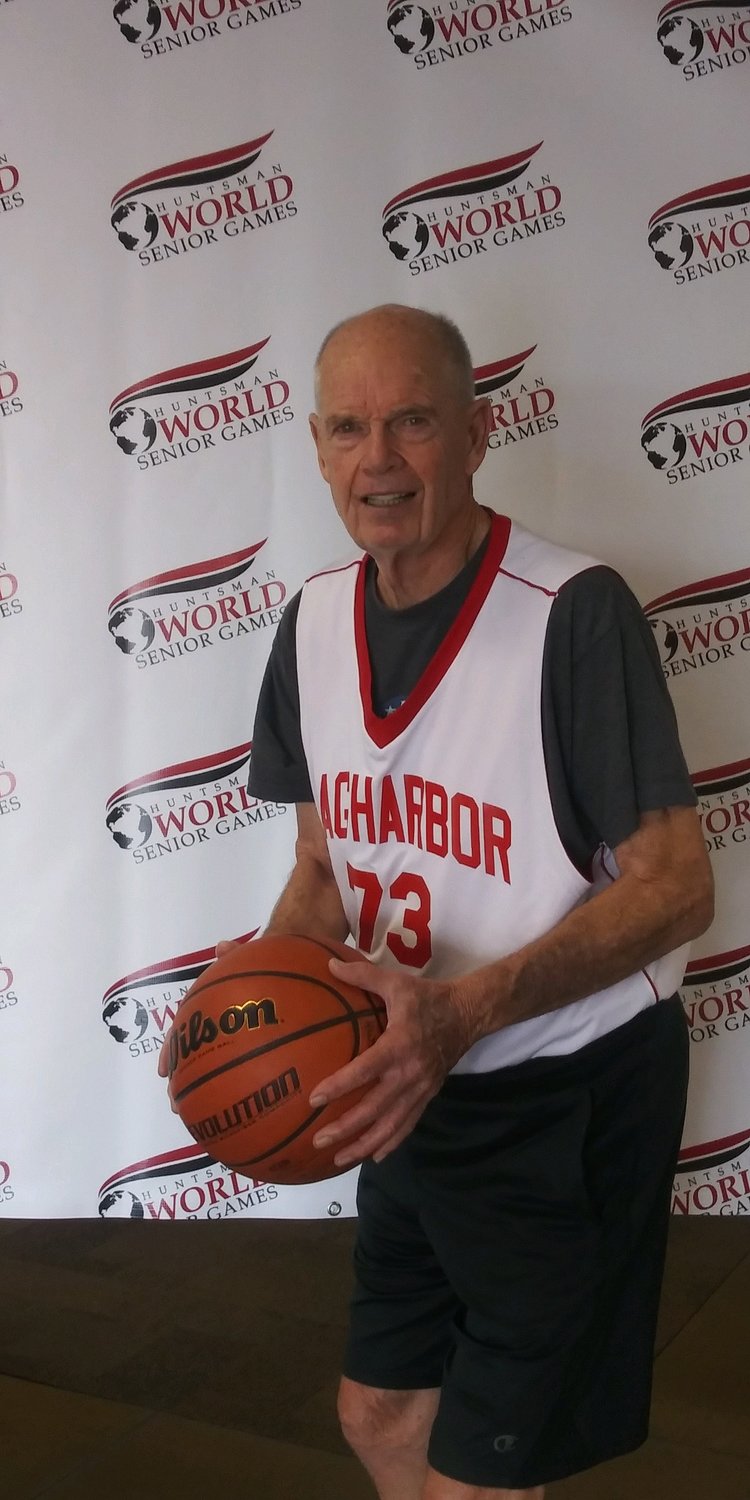 Jim Nielsen poses with a basketball at the Huntsman World Senior Games.
