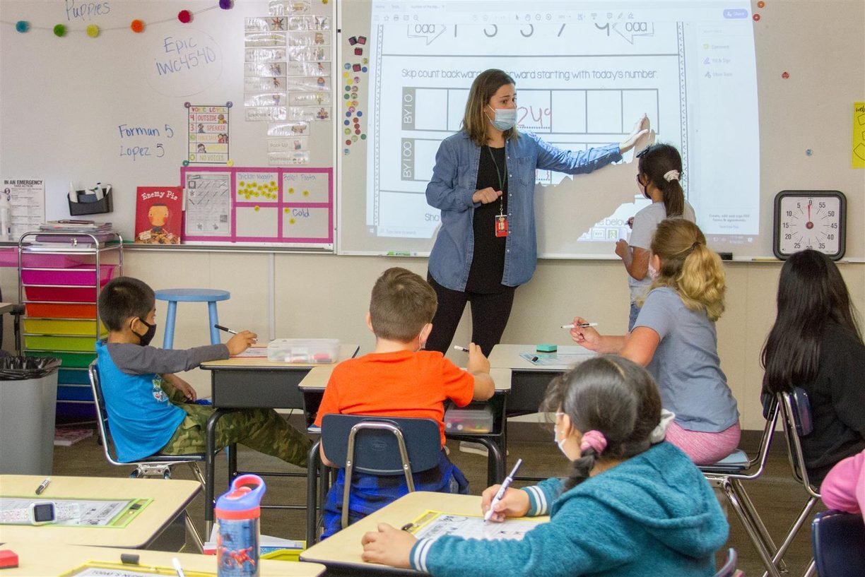 An educator teaches children in a classroom for the dual language program at Woodland Public Schools.