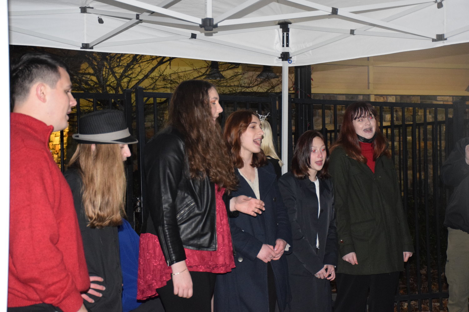 Members of the Battle Ground High School choir sing prior to the city’s tree lighting event on Dec. 3.