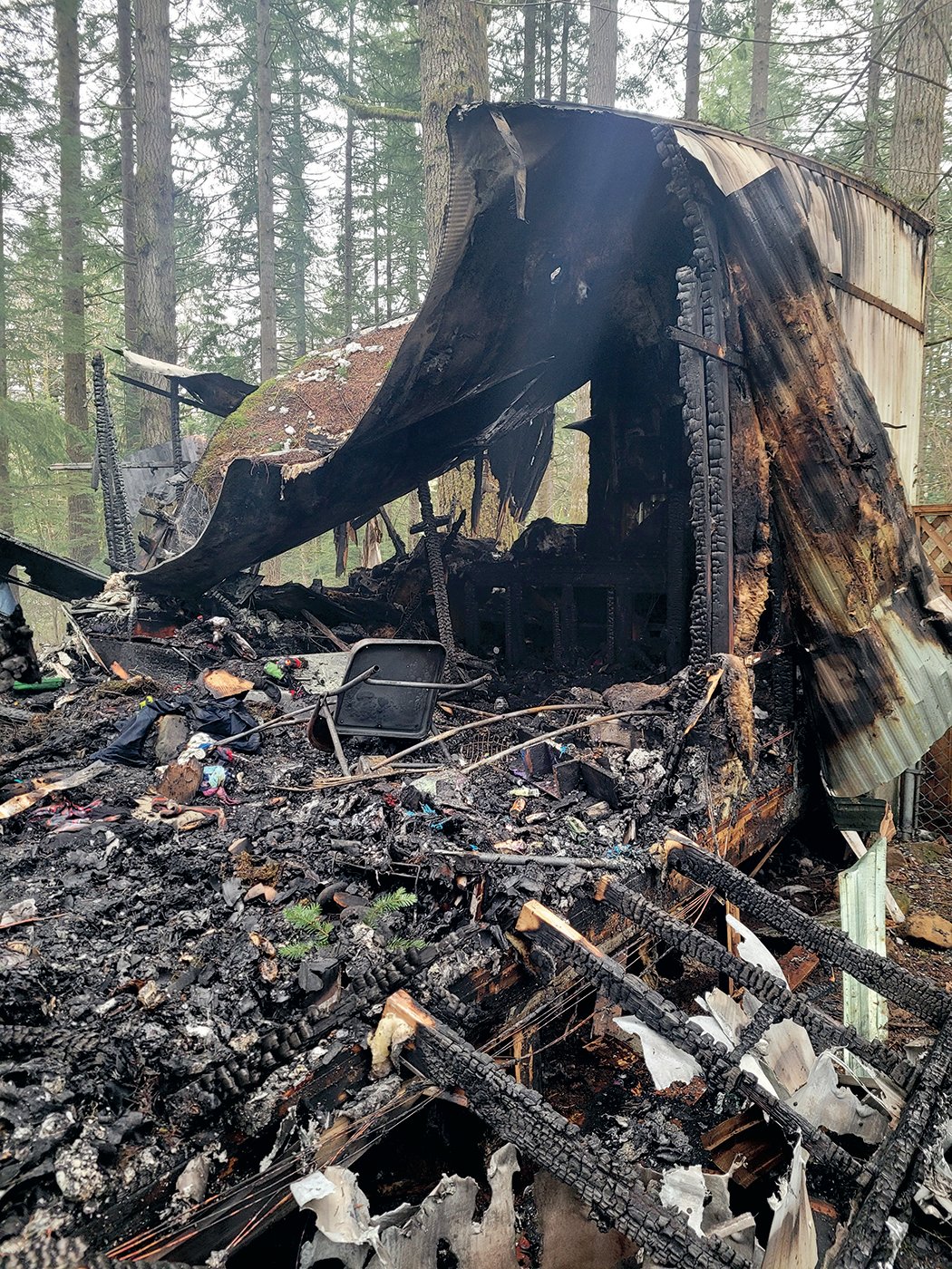 Some of the wreckage from the fire at Royal Ridges in Battle Ground is pictured.