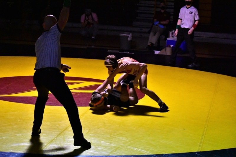 Lucas Kyle, a Prairie High School senior, pins an opponent in a match.