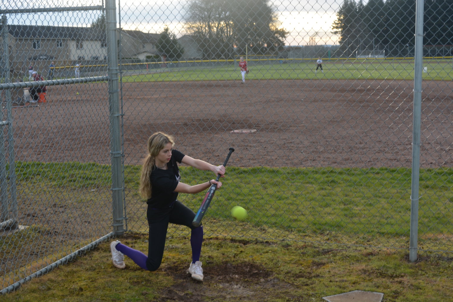 Ashley Porter practices her bunting skills at Prairie High School during softball practice on March 10 in preparation for the first game against Camas.