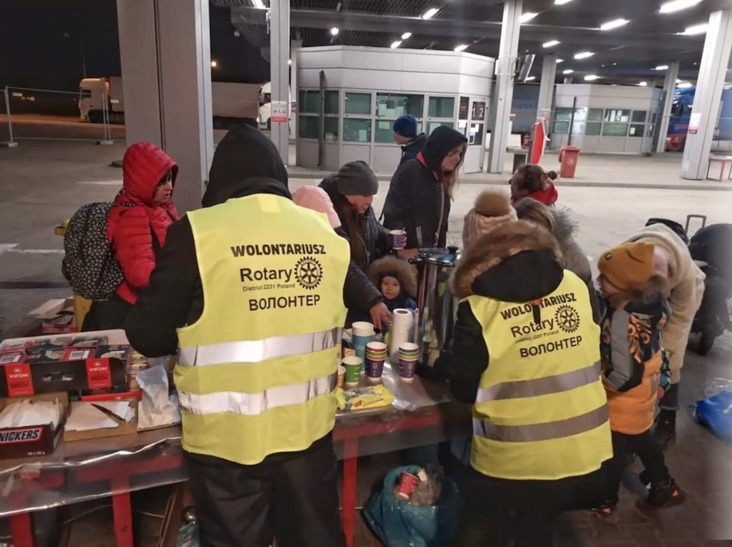 Rotarians hand out supplies to Ukrainian refugees in Zamosc, Poland as people prepare to board a bus to their next destination in these photos provided by the Rotary Club Zamosc Ordynacki.