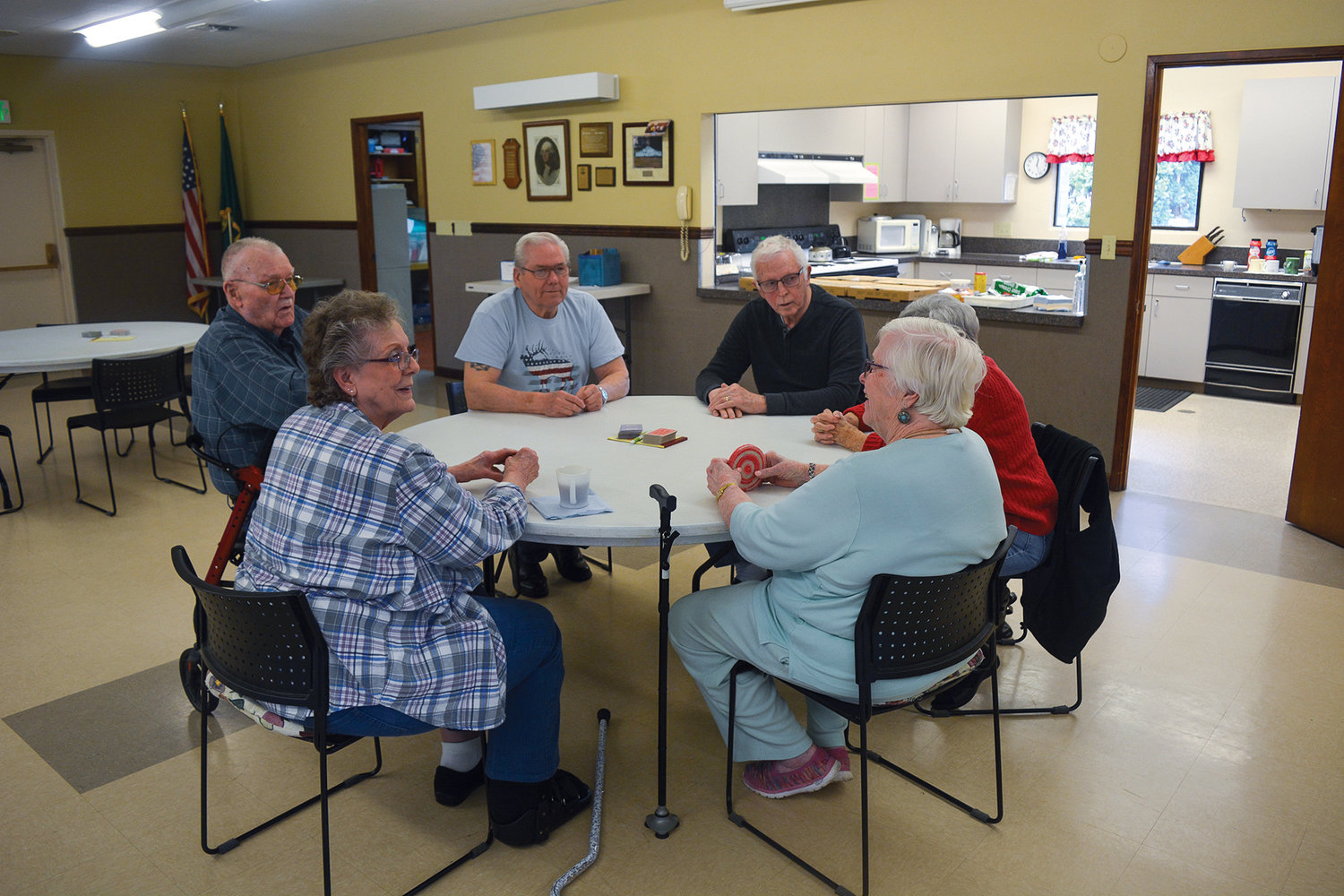 A group of seniors prepare to play a game of pinochle at the Battle Ground Senior Center on April 5.