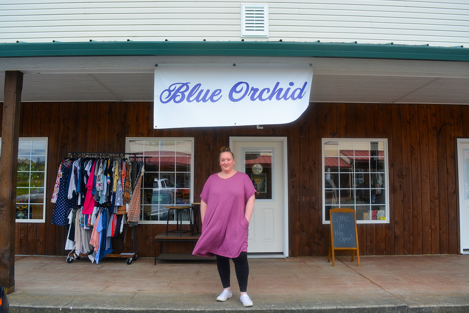 Katie Murdock stands in front of her store, Blue Orchid, in Woodland on May 3.