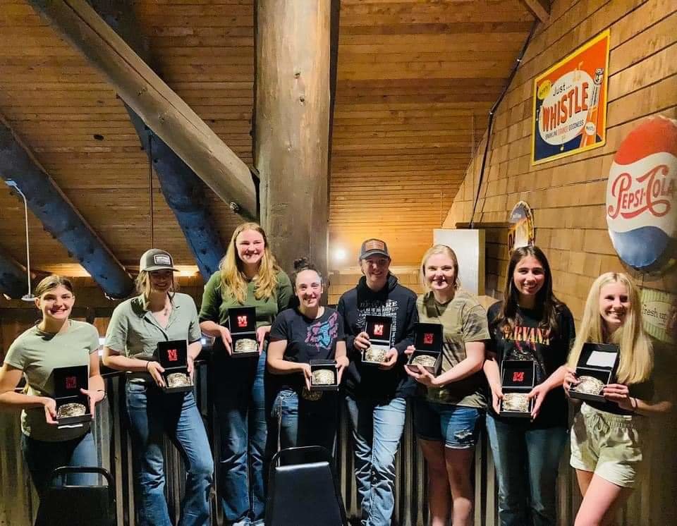 The Battle Ground Equestrian Team displays their state buckle awards.