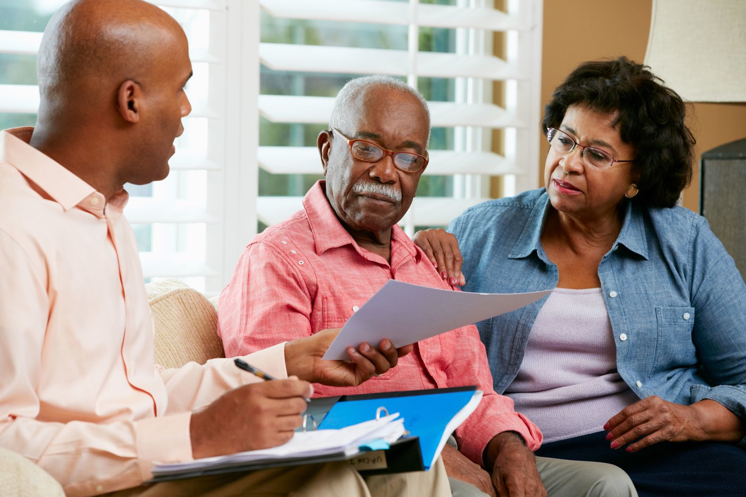 A family discusses plans with their elderly father.