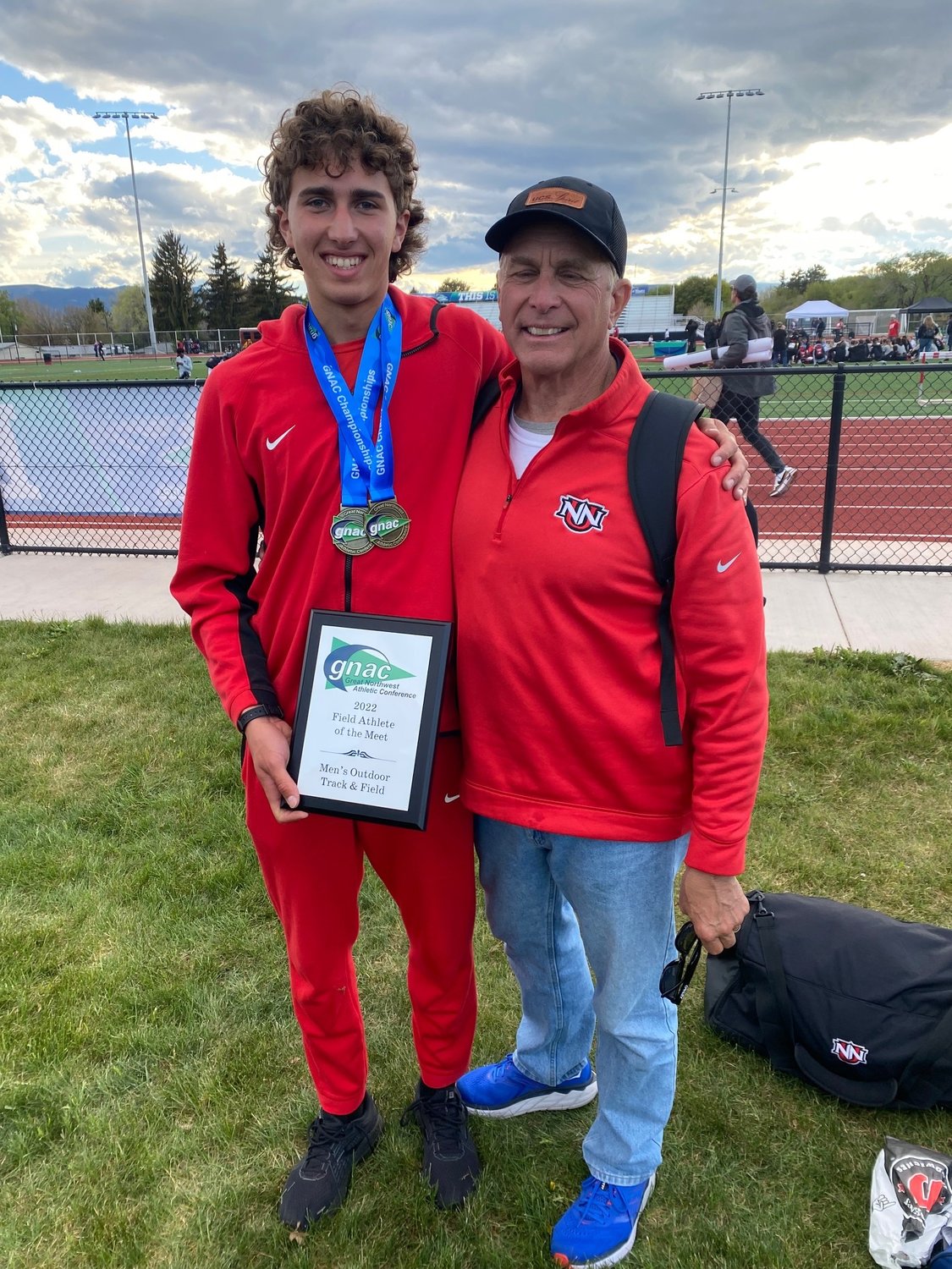 Steven Schmidt is pictured with his coach, John Mahr, during his last meet on May 14.