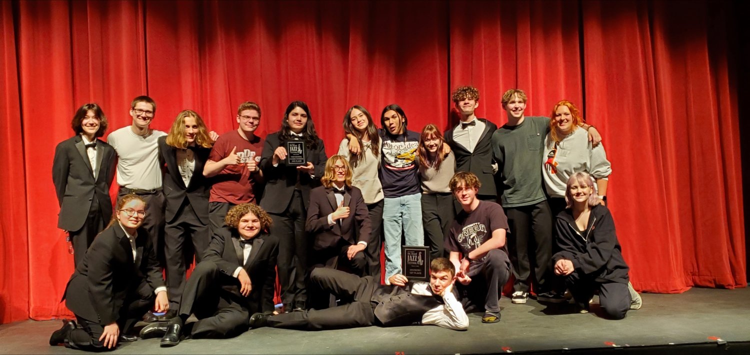 The Battle Ground High School jazz bands hold the plaques they secured at the Mt. Hood Jazz Festival.
