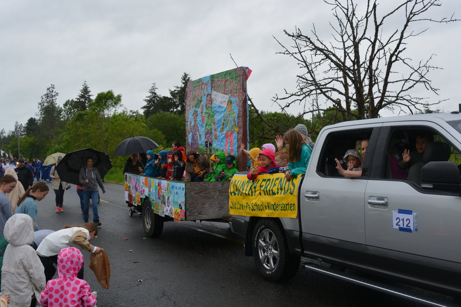Kids from Country Friends Childcare pass out candy to other children at the Fun Days parade on June 4.