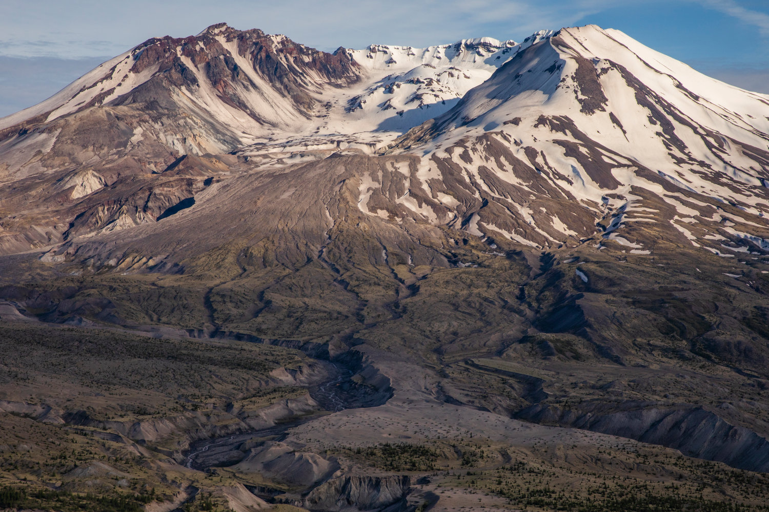 Foothills cast shadows across Mount St. Helens on on June 8.
