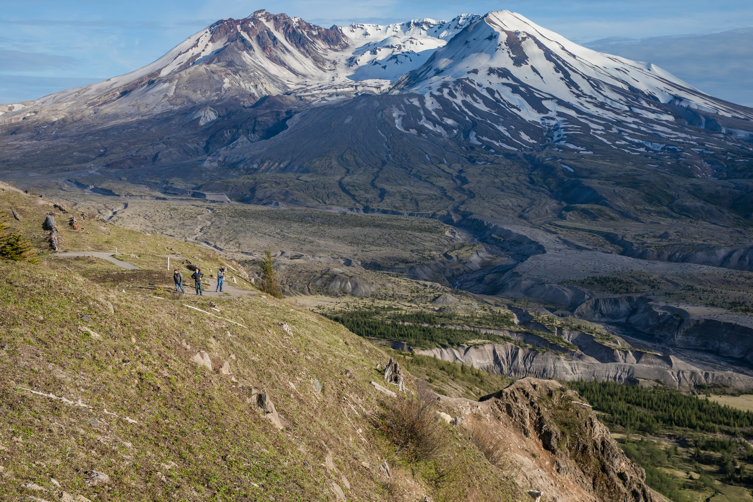 Hikers and mountain goats look on from the Mount Margaret Backcountry in the Gifford Pinchot National Forest on June 8 near Mount St. Helens.