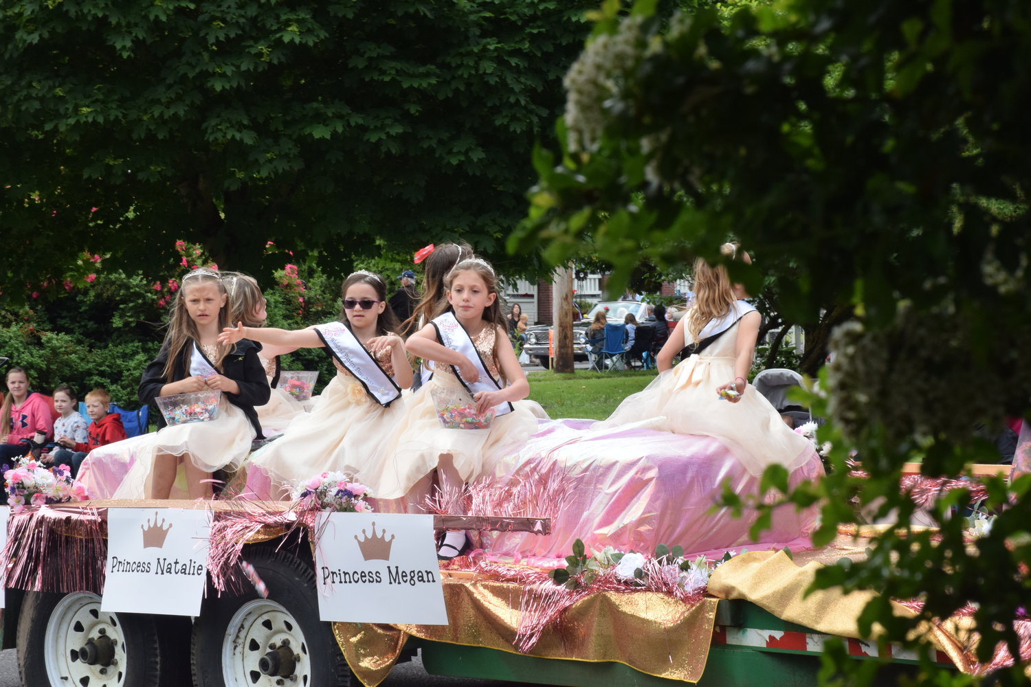 Members of Woodland Planters Days Royalty wave during the celebration’s parade on June 18.