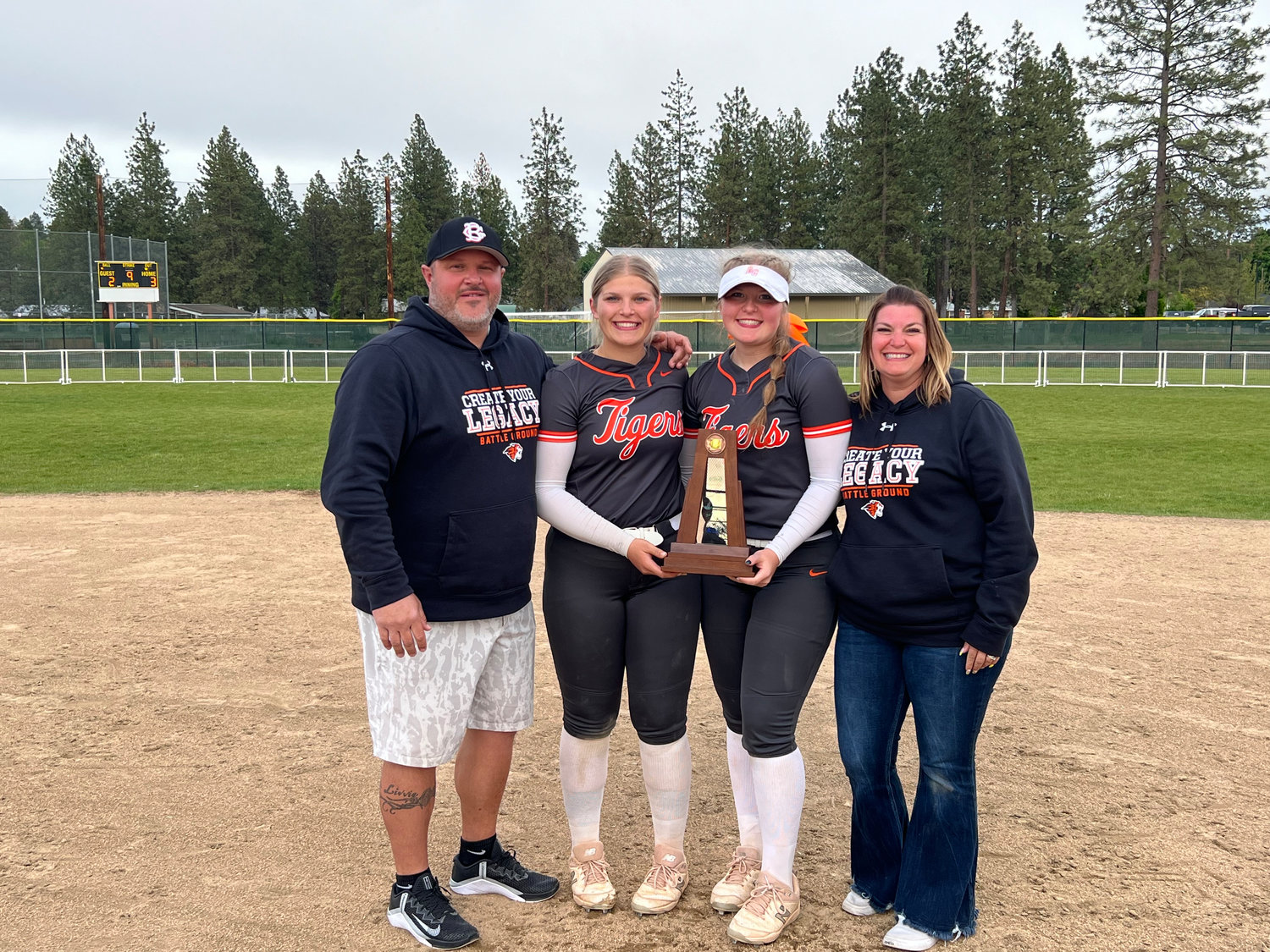 Dan, Cady, Liv, and Tiffany Gruenberg are pictured after winning third place at the state softball tournament in May.
