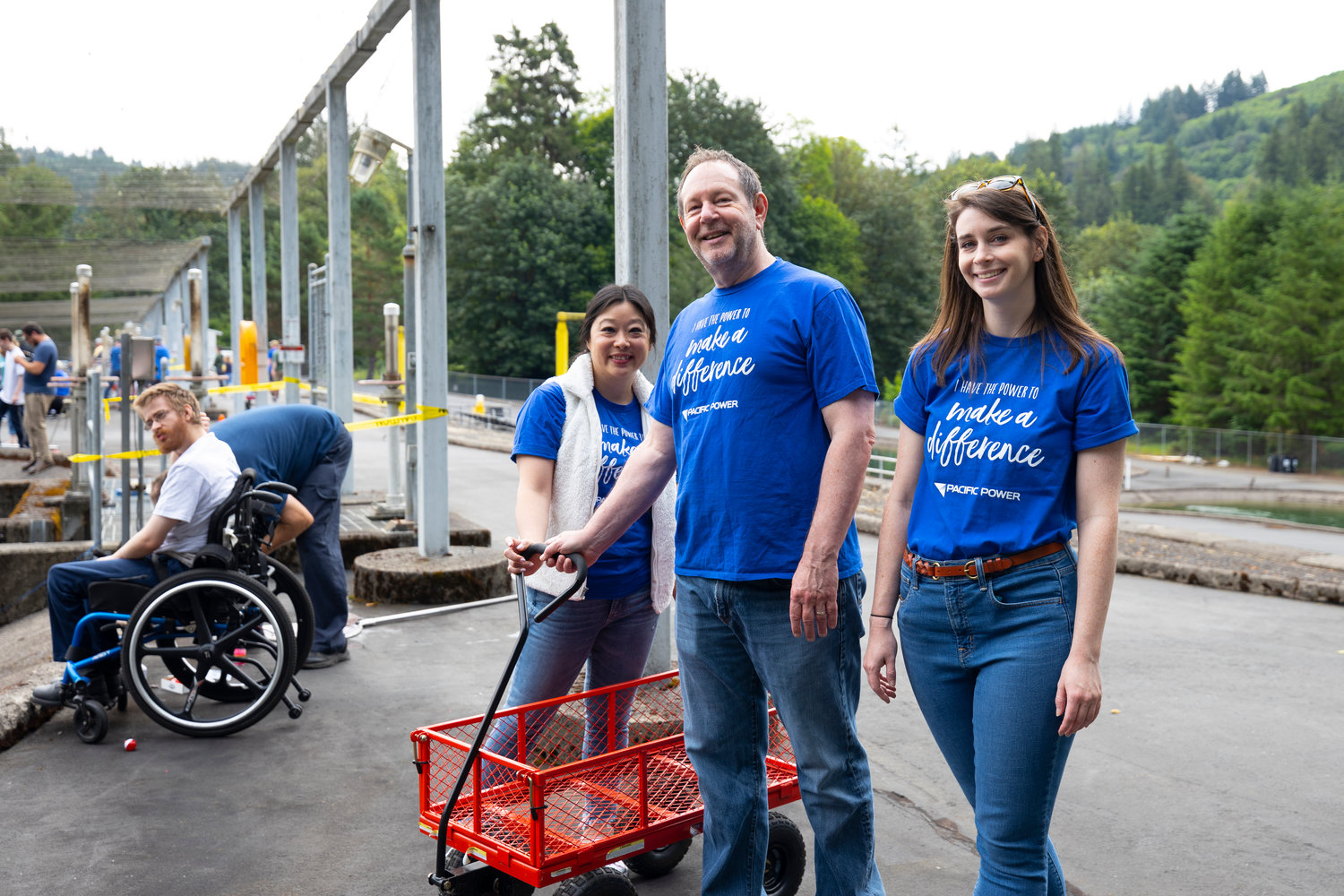 Volunteers pose with a wagon at the annual Merwin Special Kids Day event at the Merwin Fish Hatchery in Woodland on July 9.