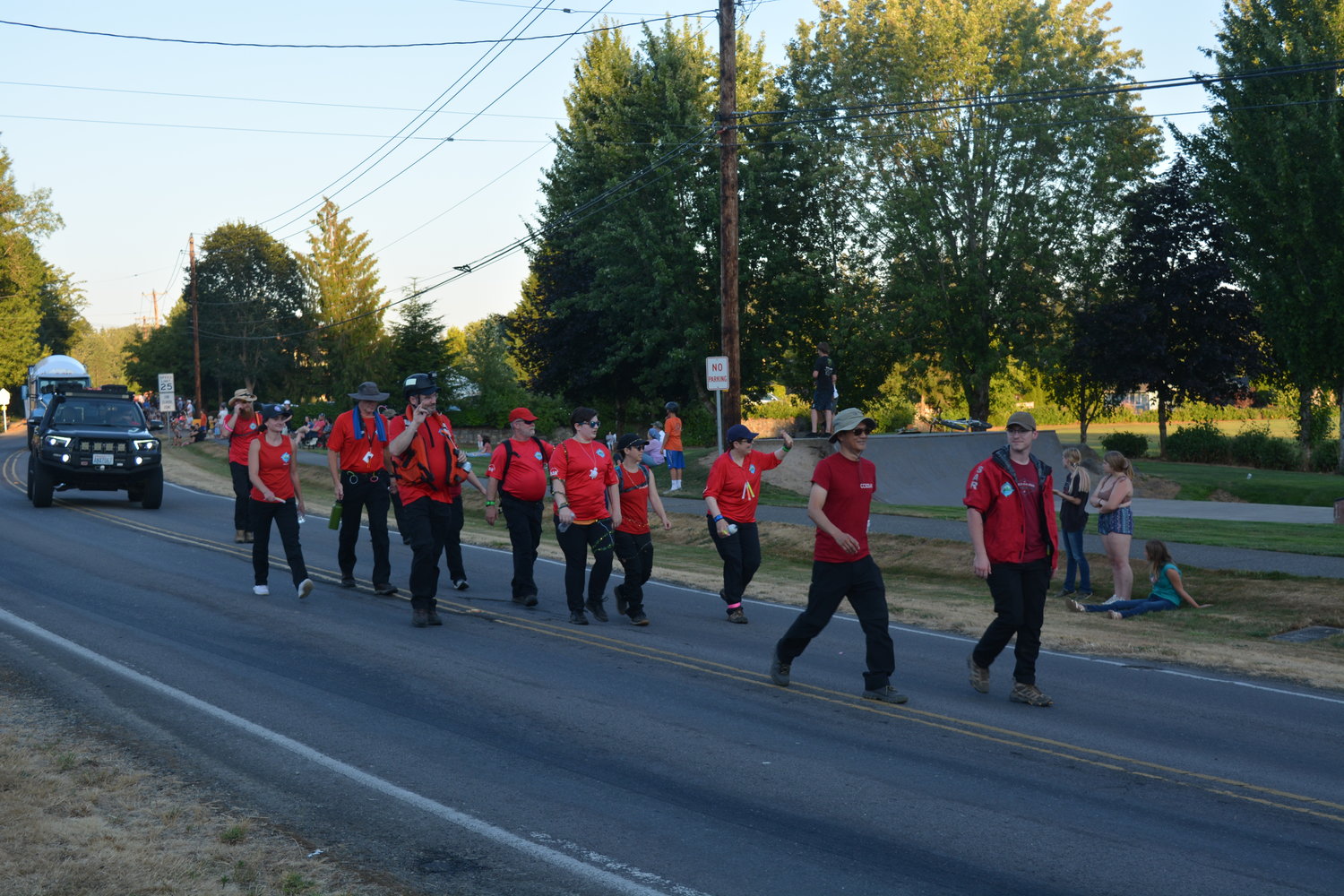 Clark County Search & Rescue members wave to the crowd as they march in the La Center Our Days parade on July 29.