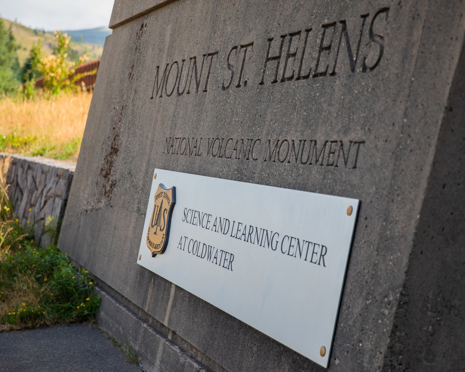 Signage is displayed outside the Mount St. Helens Science and Learning Center at Coldwater.