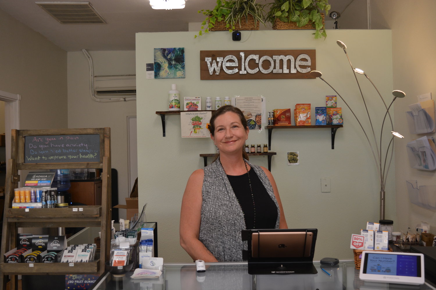 Christina Townsend stands behind the counter at Battle Ground Natural Healing on Aug. 16.