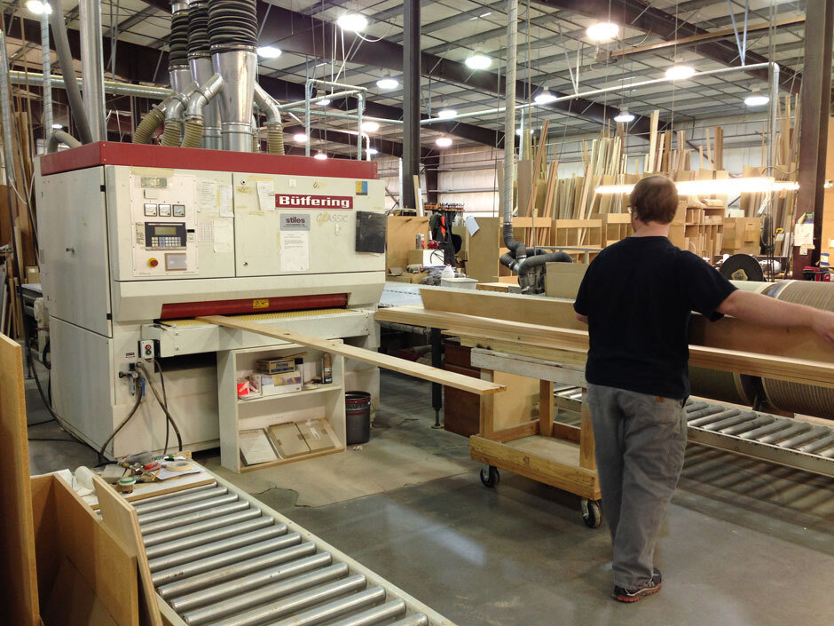A worker operates the assembly line at the Hayes Cabinets warehouse.
