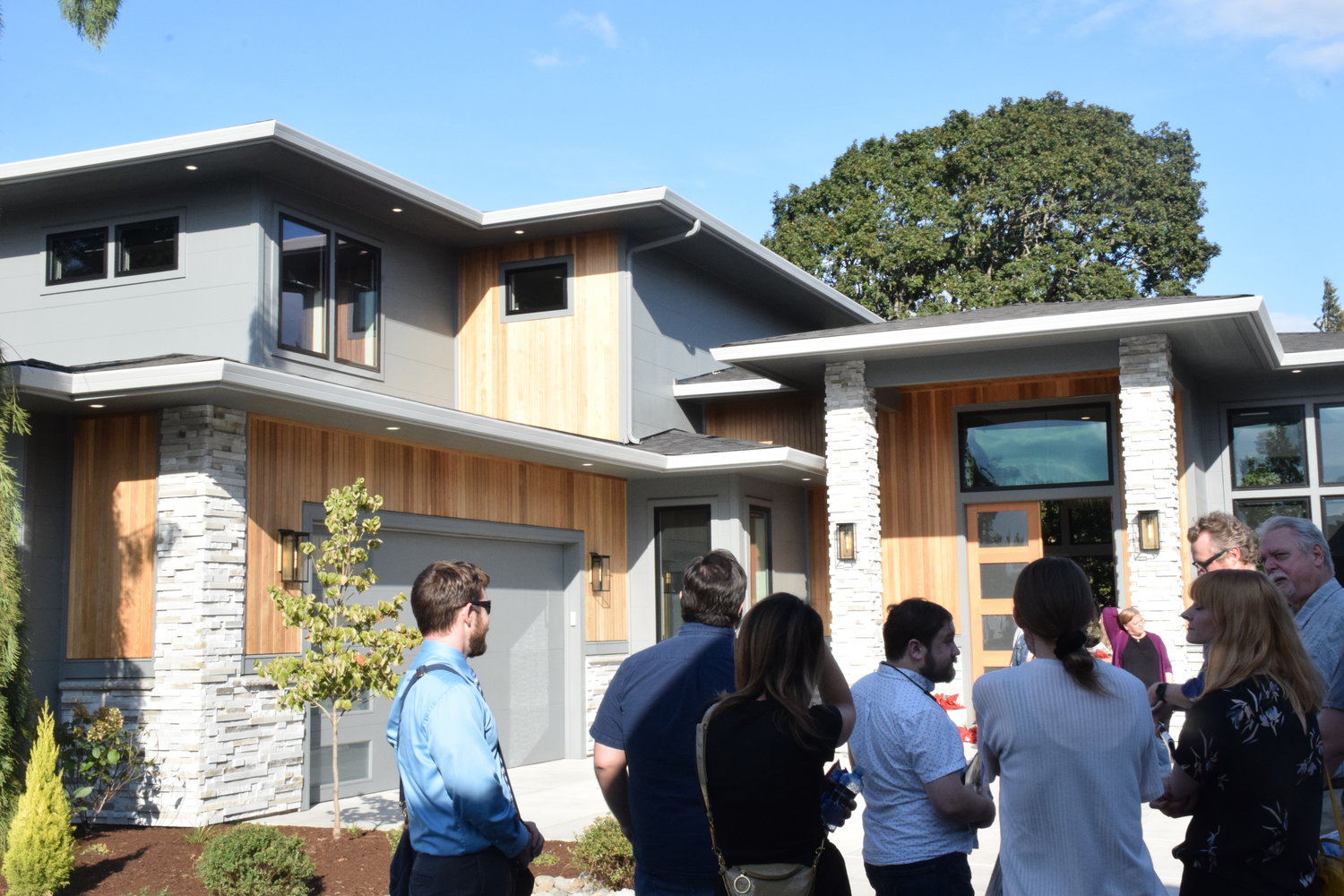 Participants of the 2022 Parade of Homes tour look at the “Oak View,” one of six homes on display during this year’s event, which is located in Ridgefield.