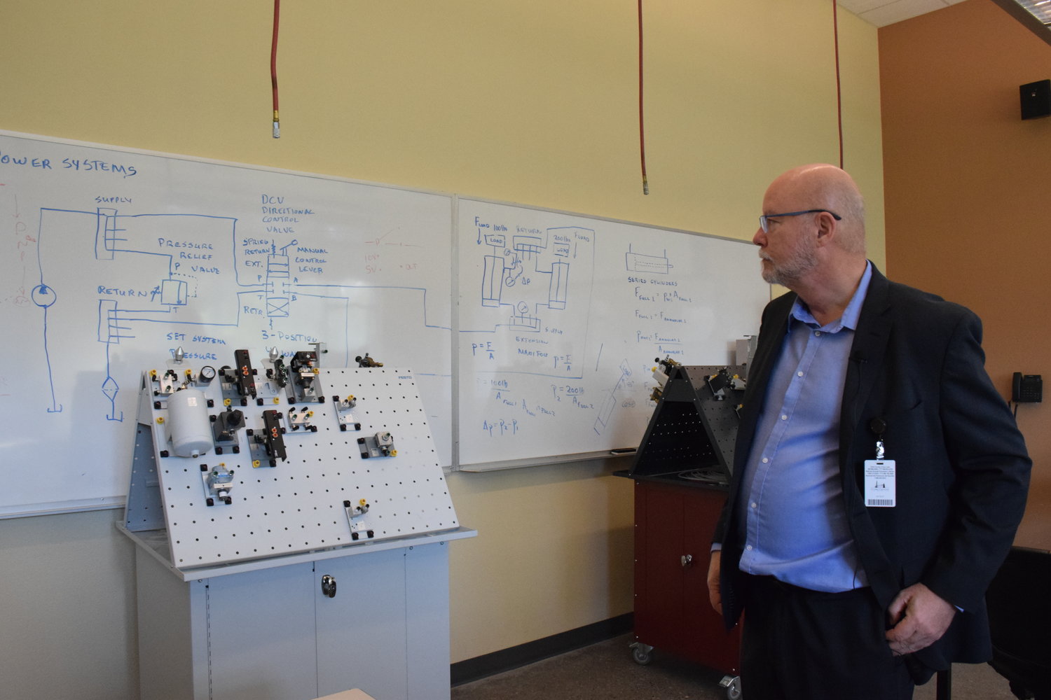 Clark College Center of Excellence for Semiconductor and Electronics Manufacturing Director Carl Douglas looks at the hardware in one of the classrooms at the college’s Columbia Tech Center campus Oct. 10.
