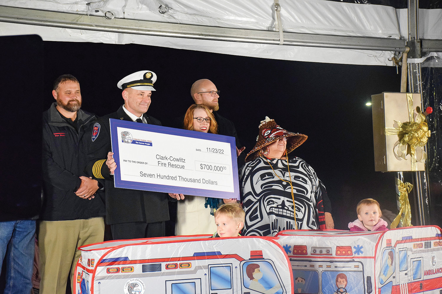 Clark-Cowlitz Fire Rescue Chief John Nohr receives a check for $700,000 from the Cowlitz Tribal Foundation during a tree lighting event at ilani on Nov. 23.